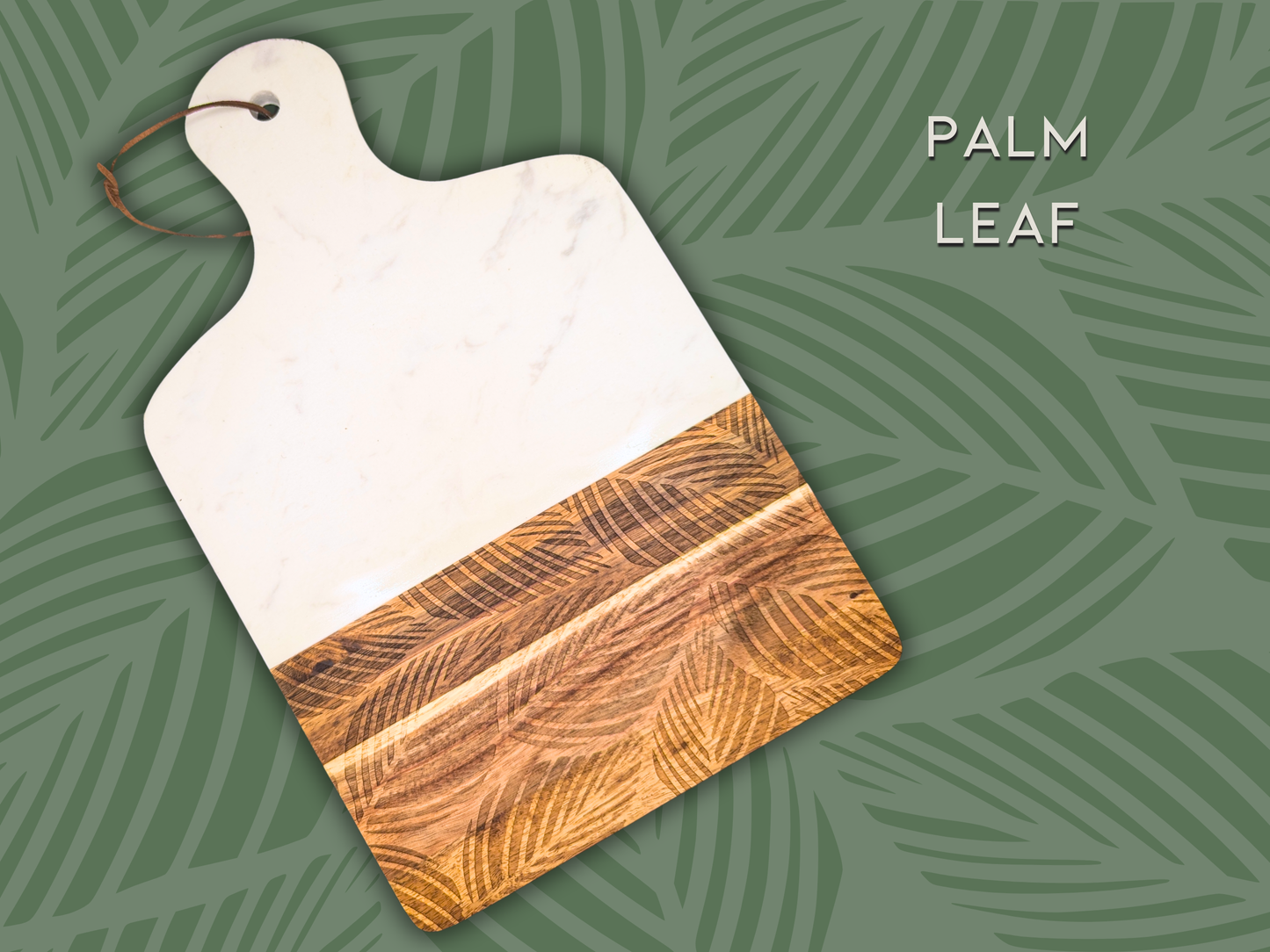 A marble and wooden charcuterie board engraved in the pattern "palm leaf". This is a botanical pattern that resembles fallen palm leaves.