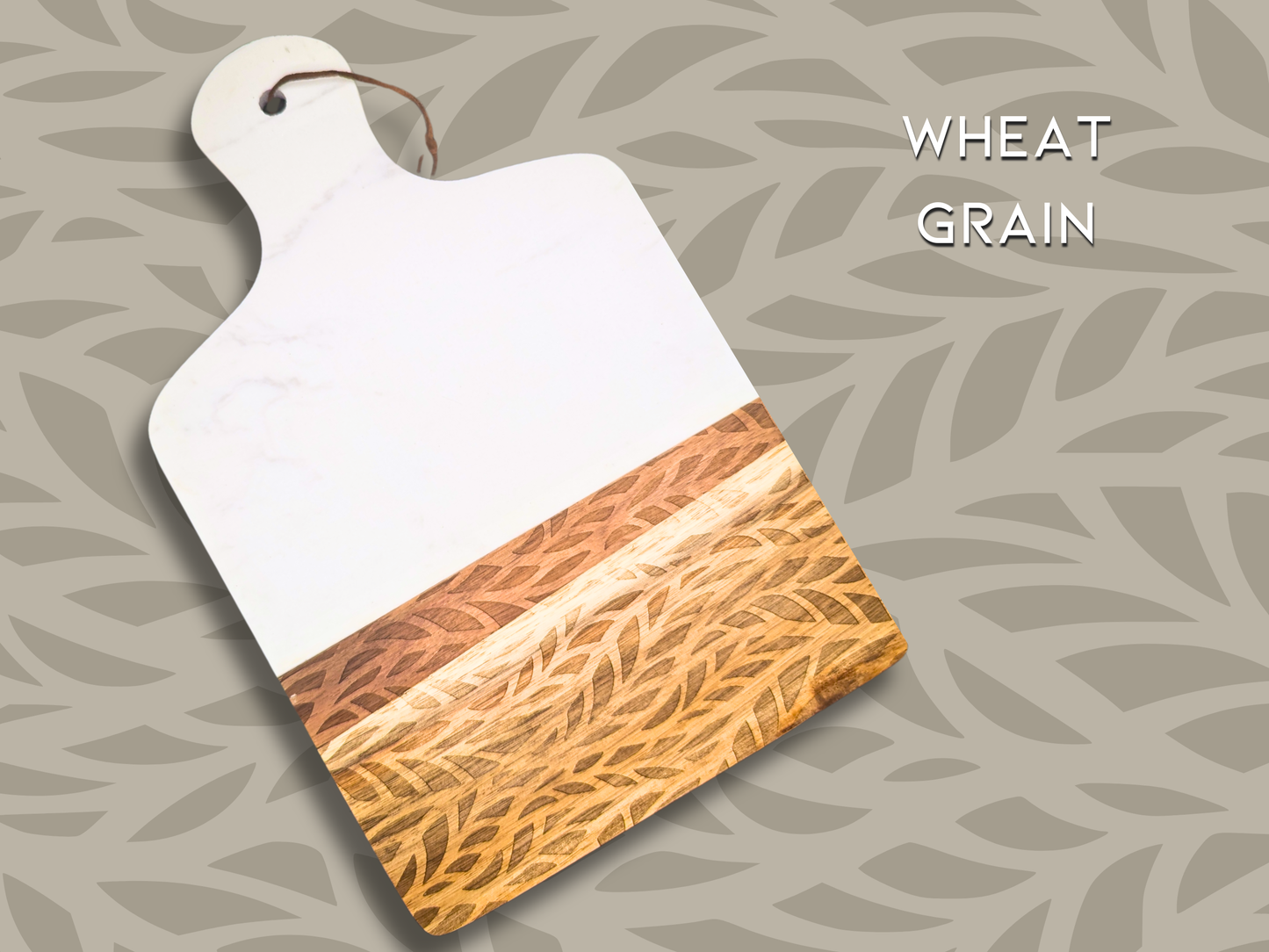 A marble and wooden charcuterie board engraved in the pattern "wheat grain". This is an organic pattern that resembles grains of wheat in a wave pattern.